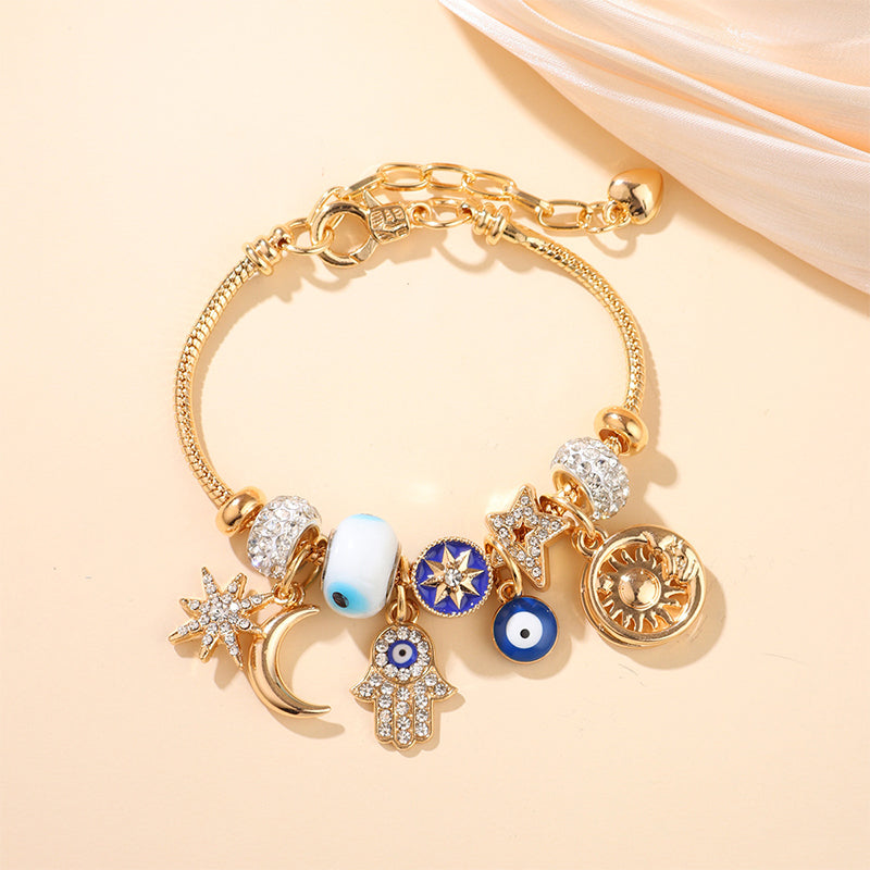 Bracelet à breloques célestes soleil et lune