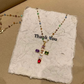 Collier avec Pendentif en Croix en Strass Colorés