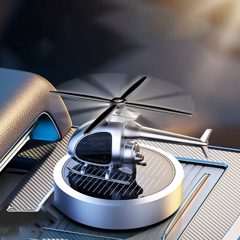 🚁 50% DE RÉDUCTION ⚡ Désodorisant hélicoptère solaire en métal – Rotation solaire & déco de voiture stylée – Diffuseur de fraîcheur, parfait pour tableau de bord ou bureau – écologique et amusant 🌿