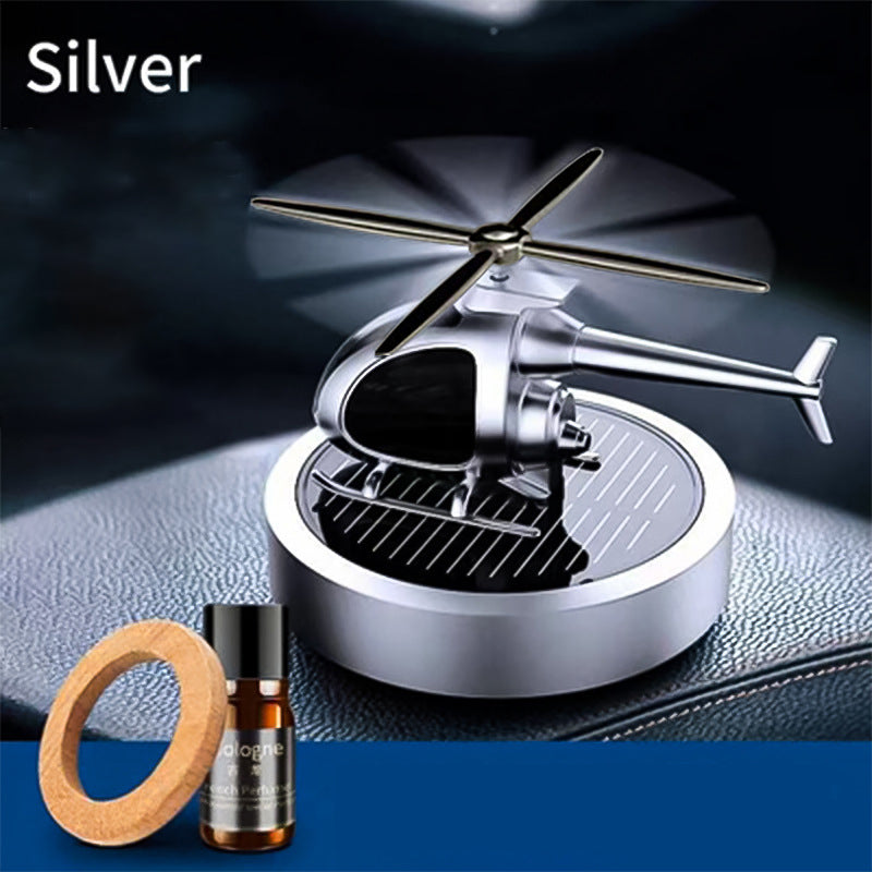🚁 50% DE RÉDUCTION ⚡ Désodorisant hélicoptère solaire en métal – Rotation solaire & déco de voiture stylée – Diffuseur de fraîcheur, parfait pour tableau de bord ou bureau – écologique et amusant 🌿